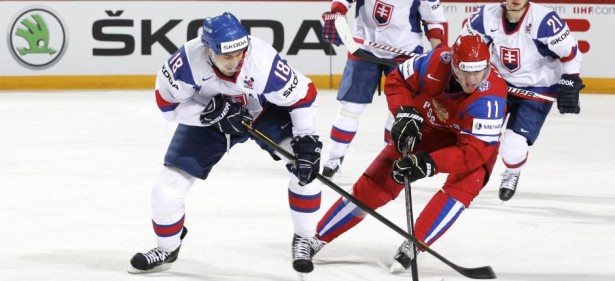 HELSINKI, FINLAND - MAY 20: Russia's Yevgeni Malkin #11 steals the puck from Slovakia's Miroslav Satan #18 during gold medal game action at the 2012 IIHF World Championship. (Photo by Andre Ringuette/HHOF-IIHF Images)